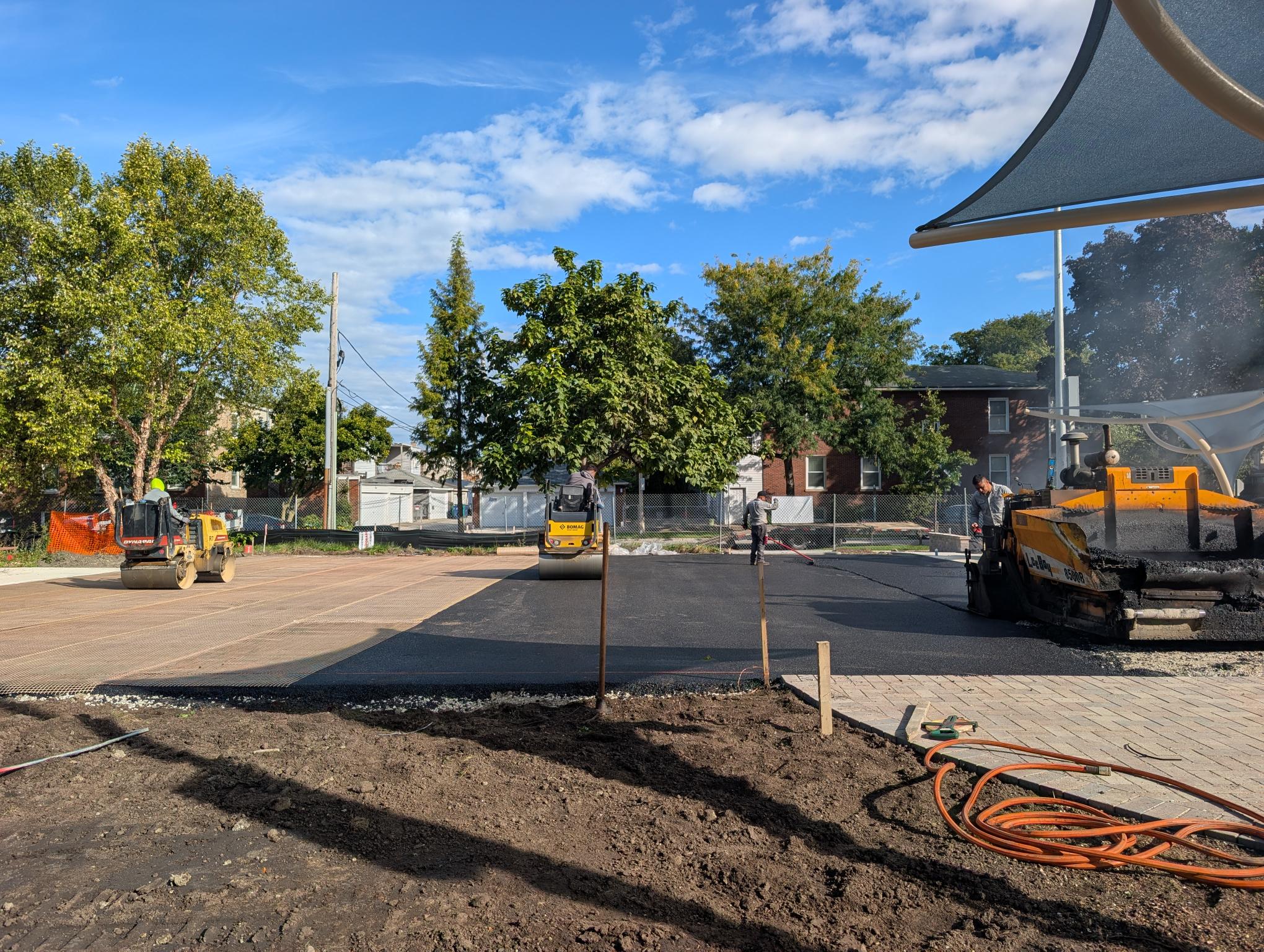 steam rollers work on the new pickleball court surface