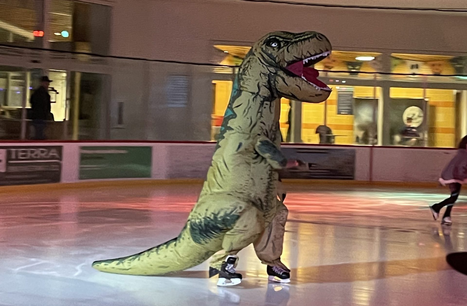 skater in t-rex costume