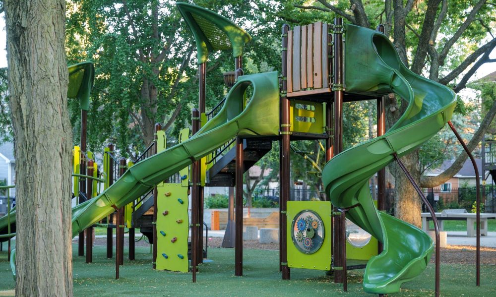 green playground with two slides