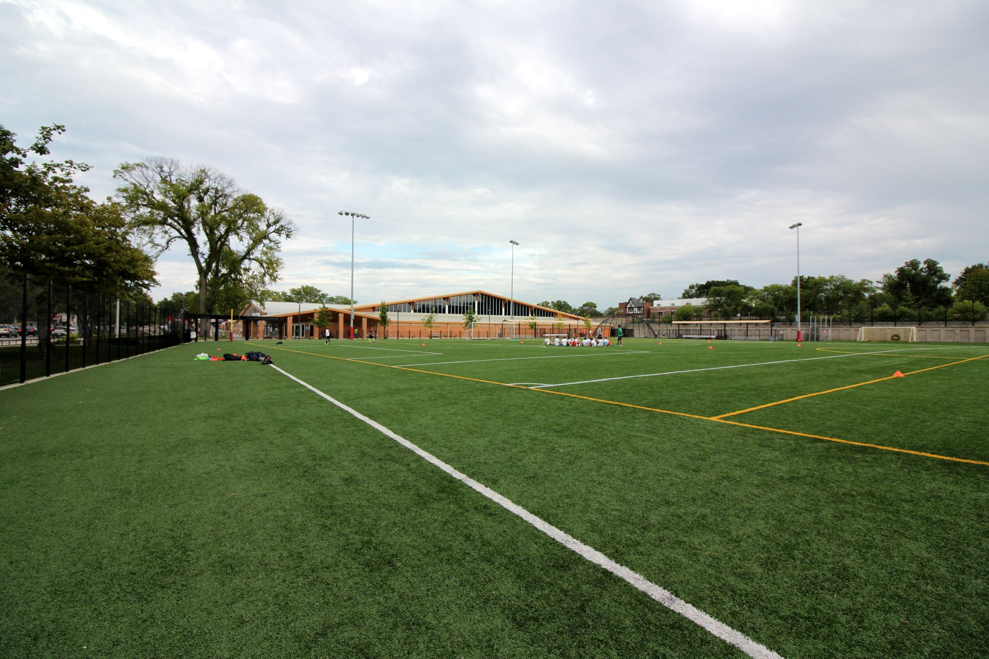 large turf field with ridgeland common building in background